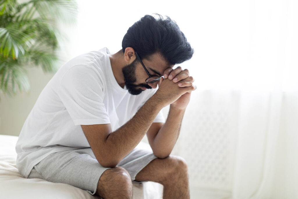 Man in pain struggling with erectile dysfunction