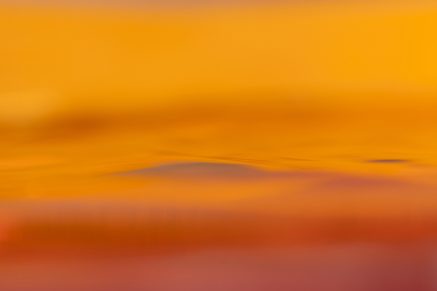 Soft abstract gradient in warm golden and amber tones suggesting gentle transition and evolving warmth - Kim Ronan Developmental Model Couples Therapist Los Angeles.